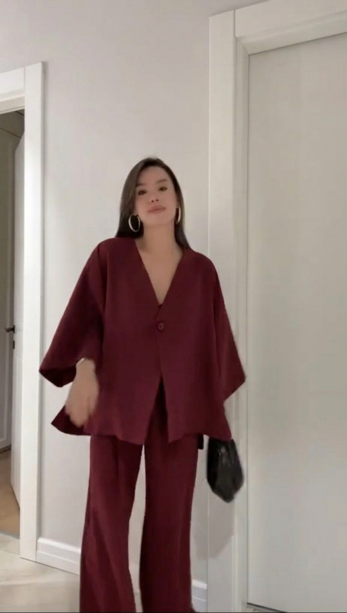 Pink women's linen shirt and loose trousers UAE summer style